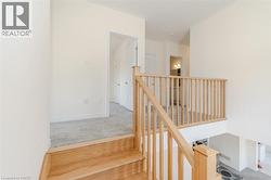 Stairs featuring carpet floors and baseboards -
