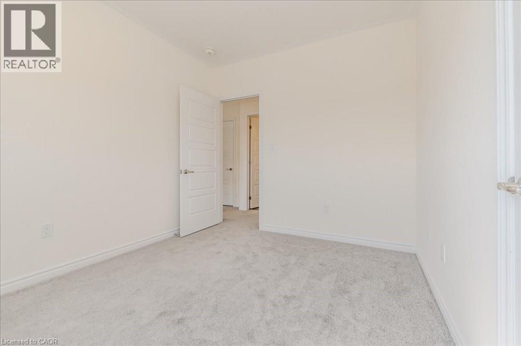 Spare room featuring light carpet and baseboards - 35 Hitchman Street, Paris, ON - Indoor Photo Showing Other Room