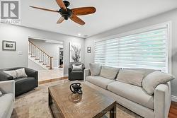 Spacious Living Room with Hardwood Flooring -