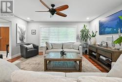 Spacious Living Room with Hardwood Flooring -