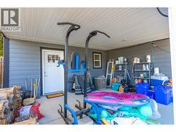 Covered lower patio, entrance into the storage area -