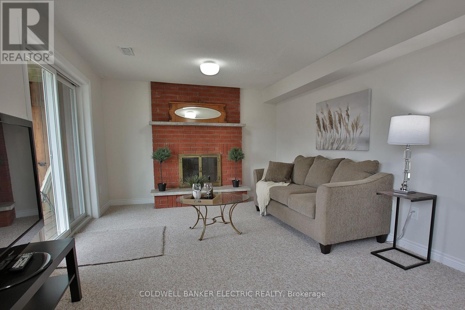 1830 Stratton Avenue, Peterborough (Monaghan Ward 2), ON - Indoor Photo Showing Living Room With Fireplace
