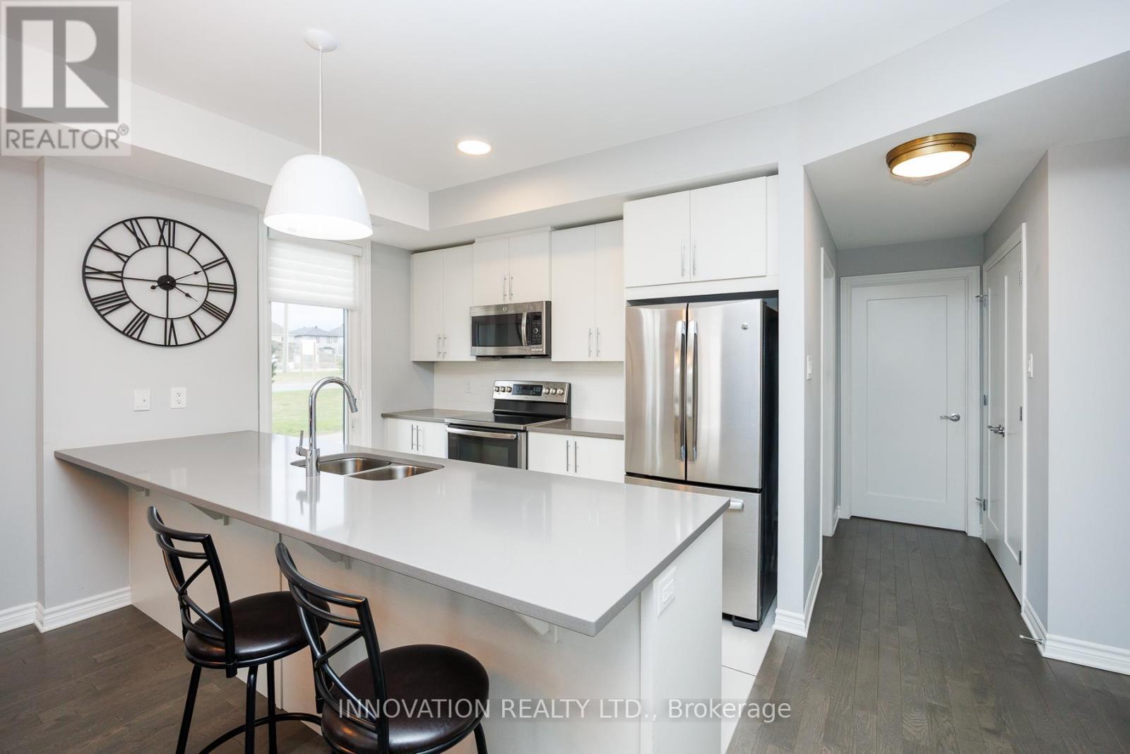 Quartz countertops and pot lights - 103 - 320 Jatoba, Ottawa, ON - Indoor Photo Showing Kitchen With Stainless Steel Kitchen With Double Sink With Upgraded Kitchen
