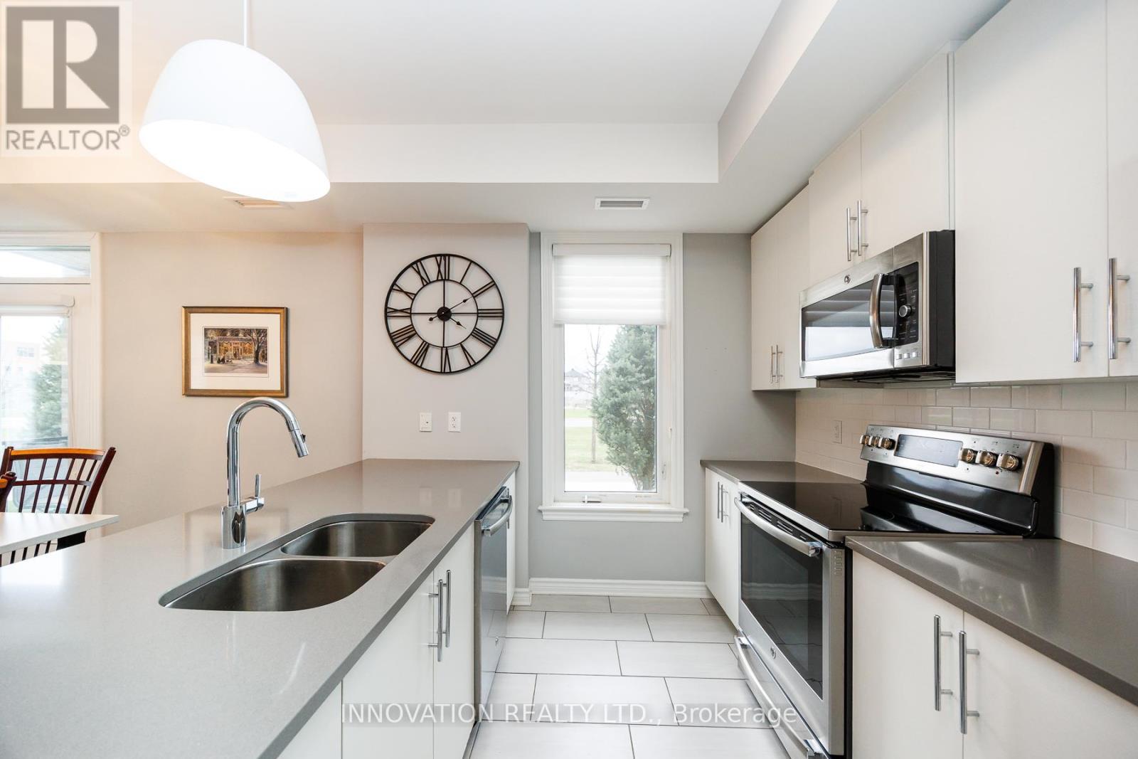 Bright & sunny - 103 - 320 Jatoba, Ottawa, ON - Indoor Photo Showing Kitchen With Double Sink
