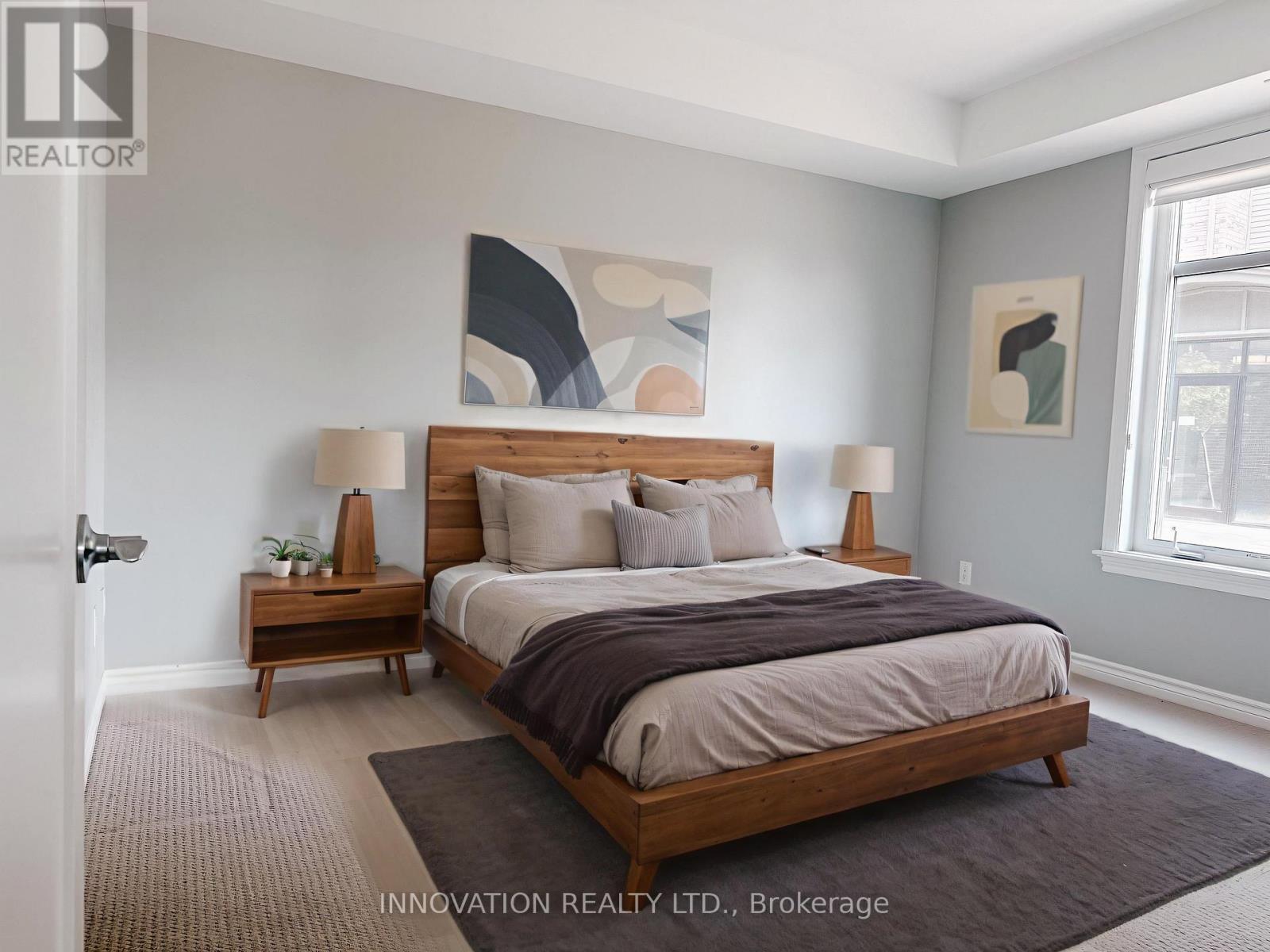 Primary bedroom w walk-in closet - 103 - 320 Jatoba, Ottawa, ON - Indoor Photo Showing Bedroom