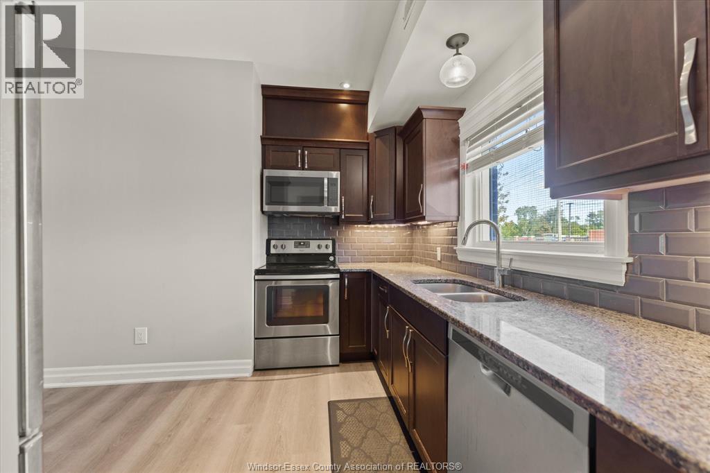 111 Sandwich Street South Unit# 201, Amherstburg, ON - Indoor Photo Showing Kitchen With Double Sink With Upgraded Kitchen