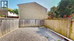 View of fenced backyard -