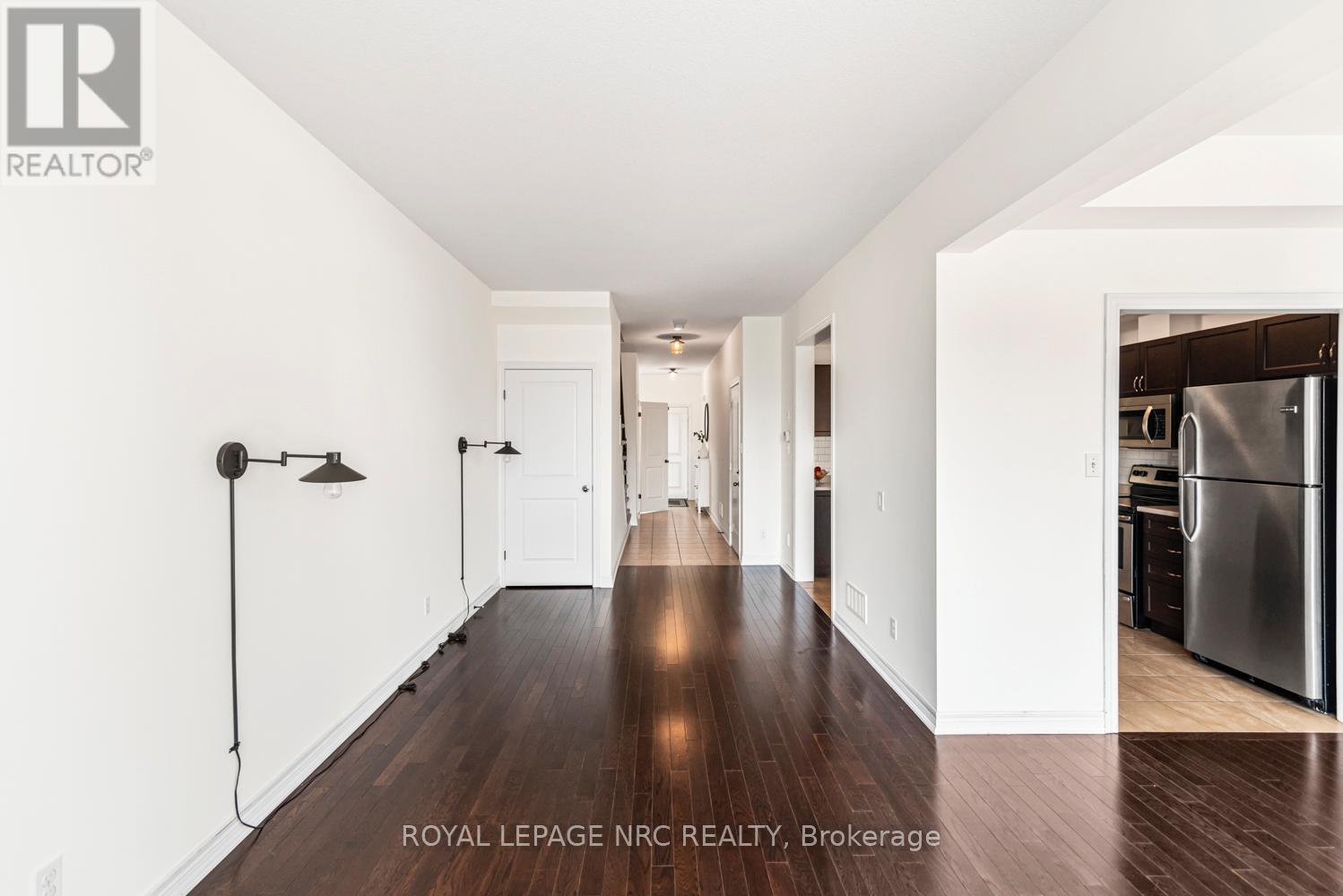 Featuring Hardwood Floors - 22 - 45 Seabreeze Crescent, Hamilton, ON - Indoor Photo Showing Other Room