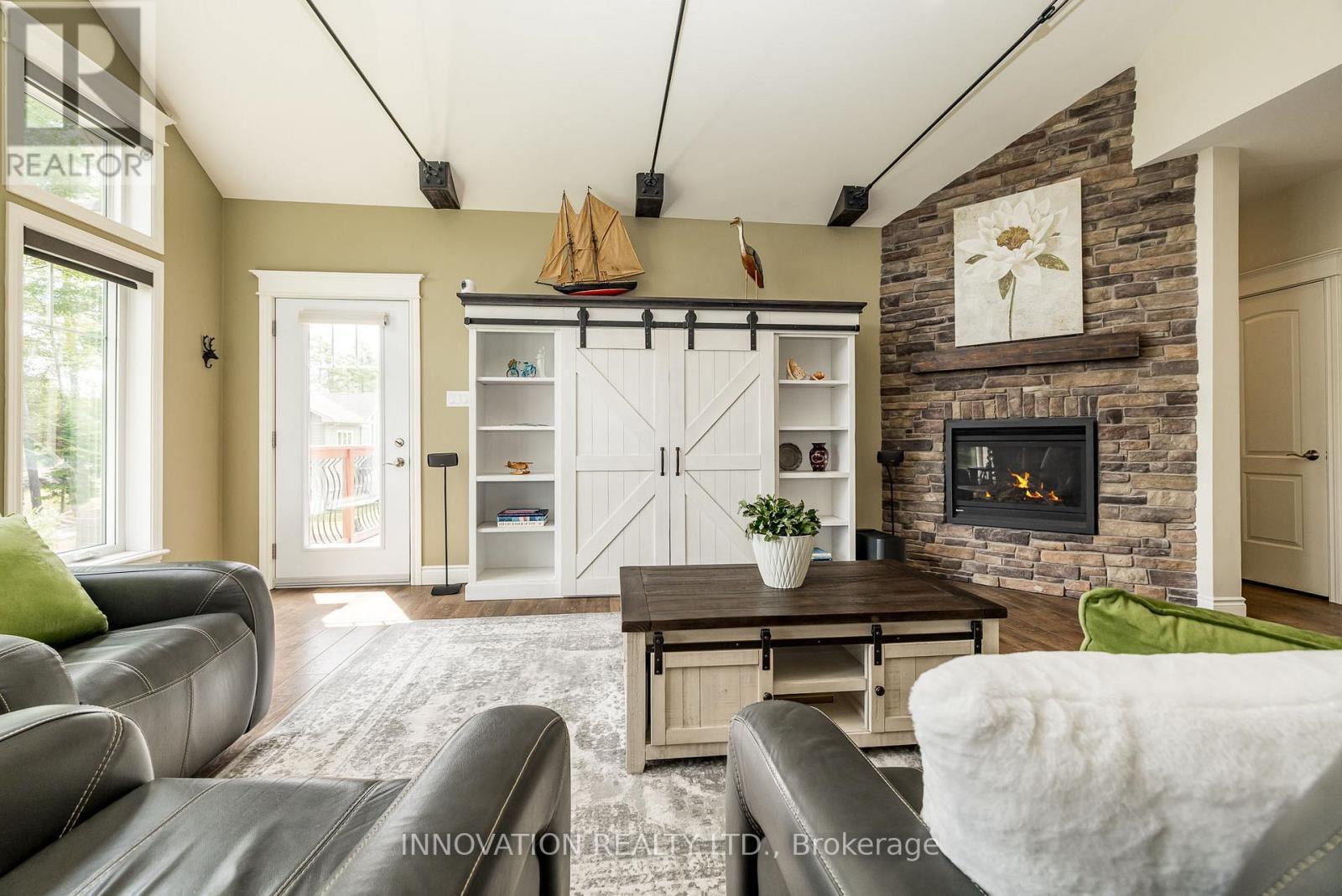 103 A Carriage Landing Drive, Horton, ON - Indoor Photo Showing Living Room With Fireplace