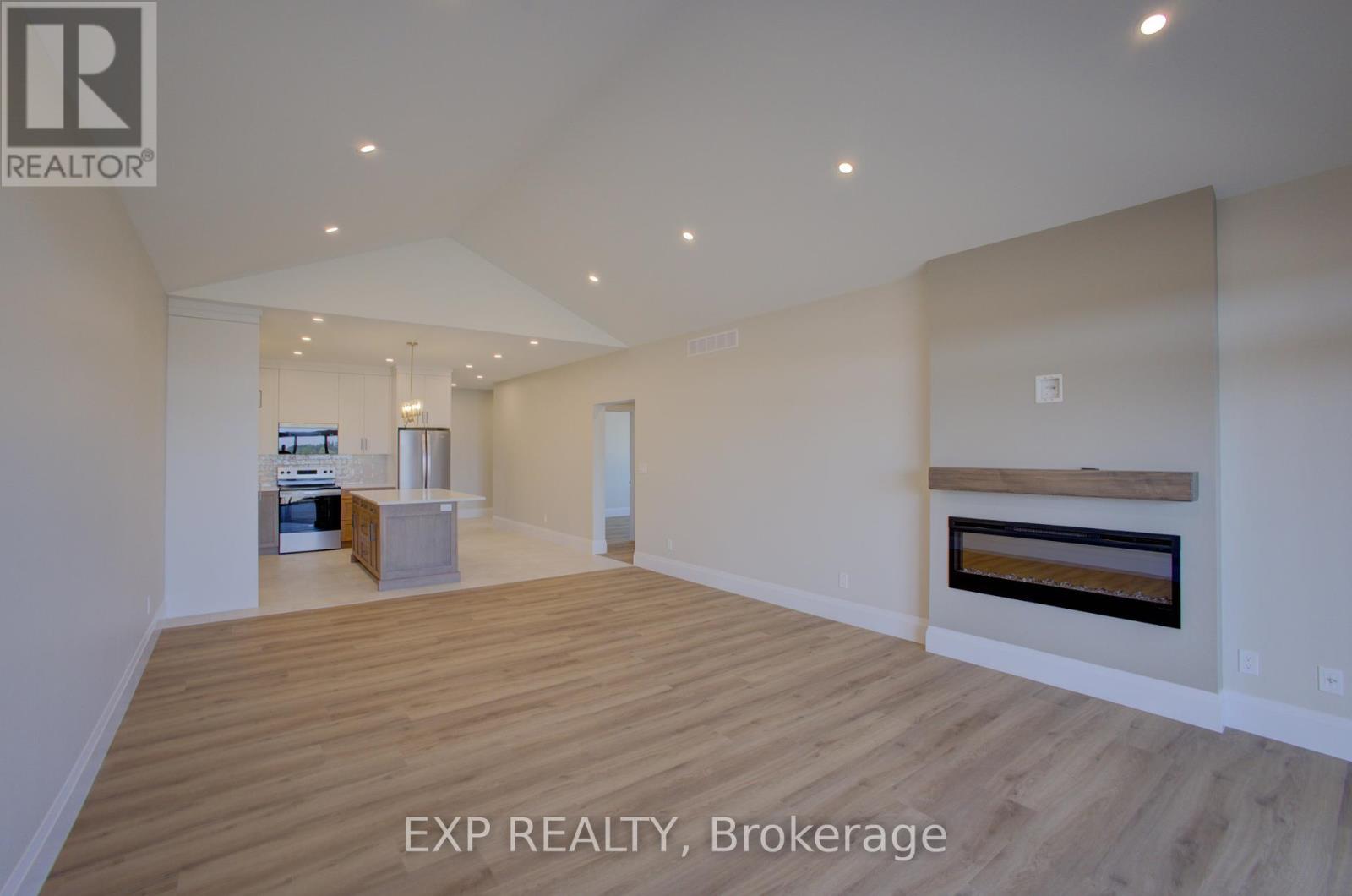 91 Bedell Drive, Mapleton, ON - Indoor Photo Showing Living Room With Fireplace