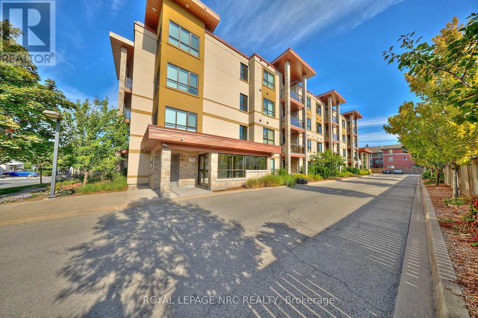 Landscaped entry to the property. - 304 - 26 Wellington Street, St. Catharines (Downtown), ON - Outdoor With Facade