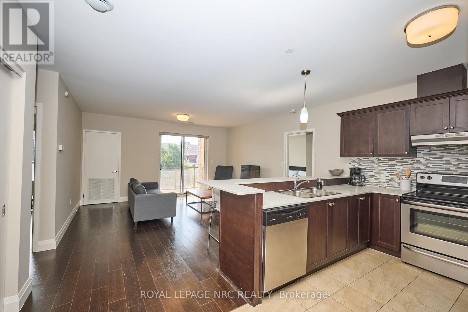 Bright and open entry. - 304 - 26 Wellington Street, St. Catharines (Downtown), ON - Indoor Photo Showing Kitchen With Stainless Steel Kitchen With Double Sink With Upgraded Kitchen
