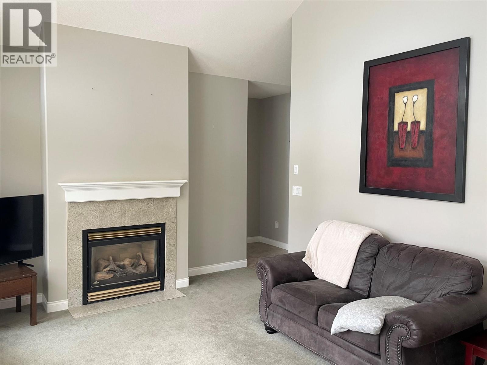 253 Chase Road, Christina Lake, BC - Indoor Photo Showing Living Room With Fireplace