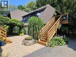 back area of house and outside stairs to balcony -