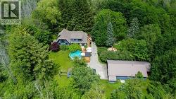 Aerial view of house, fire pit and detached garage -
