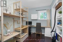 Main floor office with build in shelves -