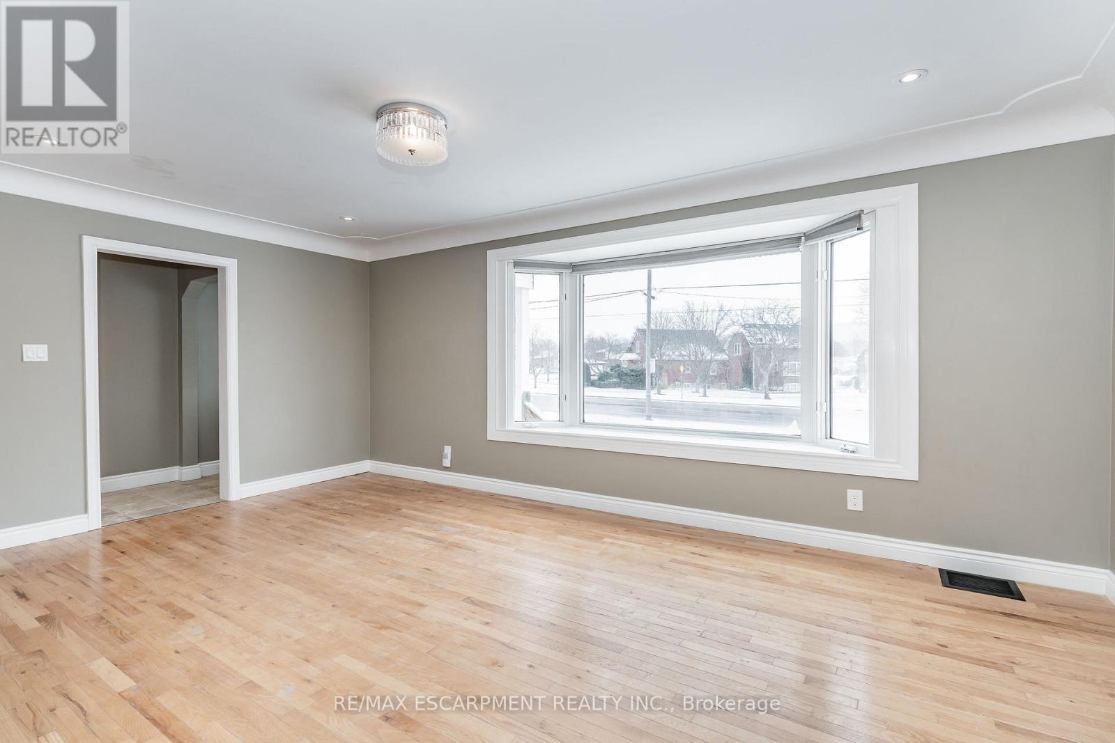 Large Bay Window - (Upper) - 317 King Street E, Hamilton, ON - Indoor Photo Showing Other Room