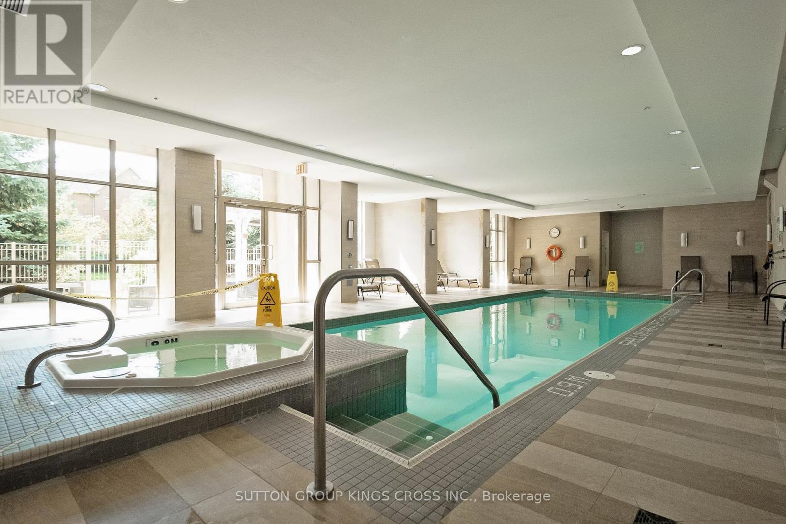 201 - 2470 Prince Michael Drive, Oakville, ON - Indoor Photo Showing Other Room With In Ground Pool