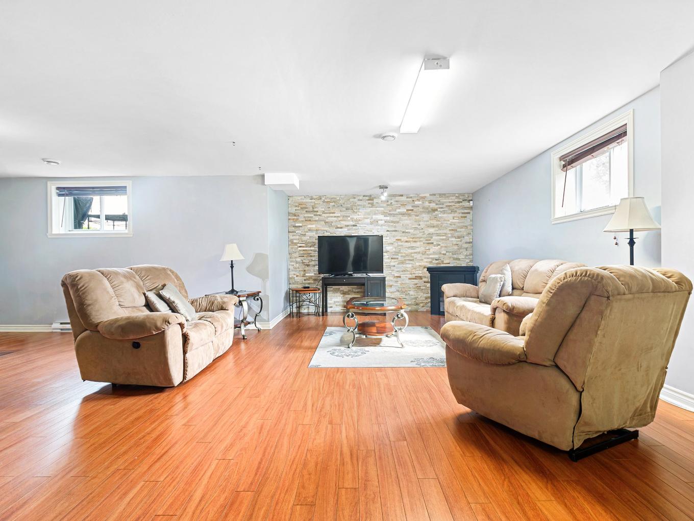 Playroom - 3262 Rue De La Brisardière, Longueuil (Saint-Hubert), QC - Indoor Photo Showing Living Room With Fireplace
