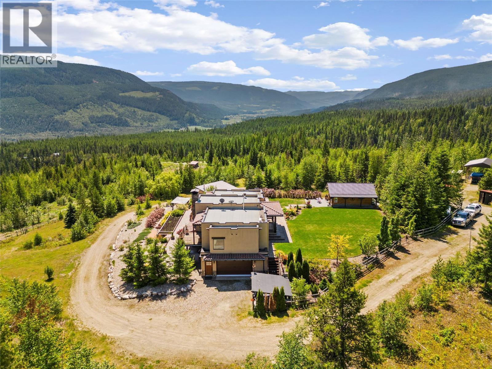 Flat useable land, gardens & green space around the home - 1309 Eagle Ridge Road, Lumby, BC - Outdoor With View