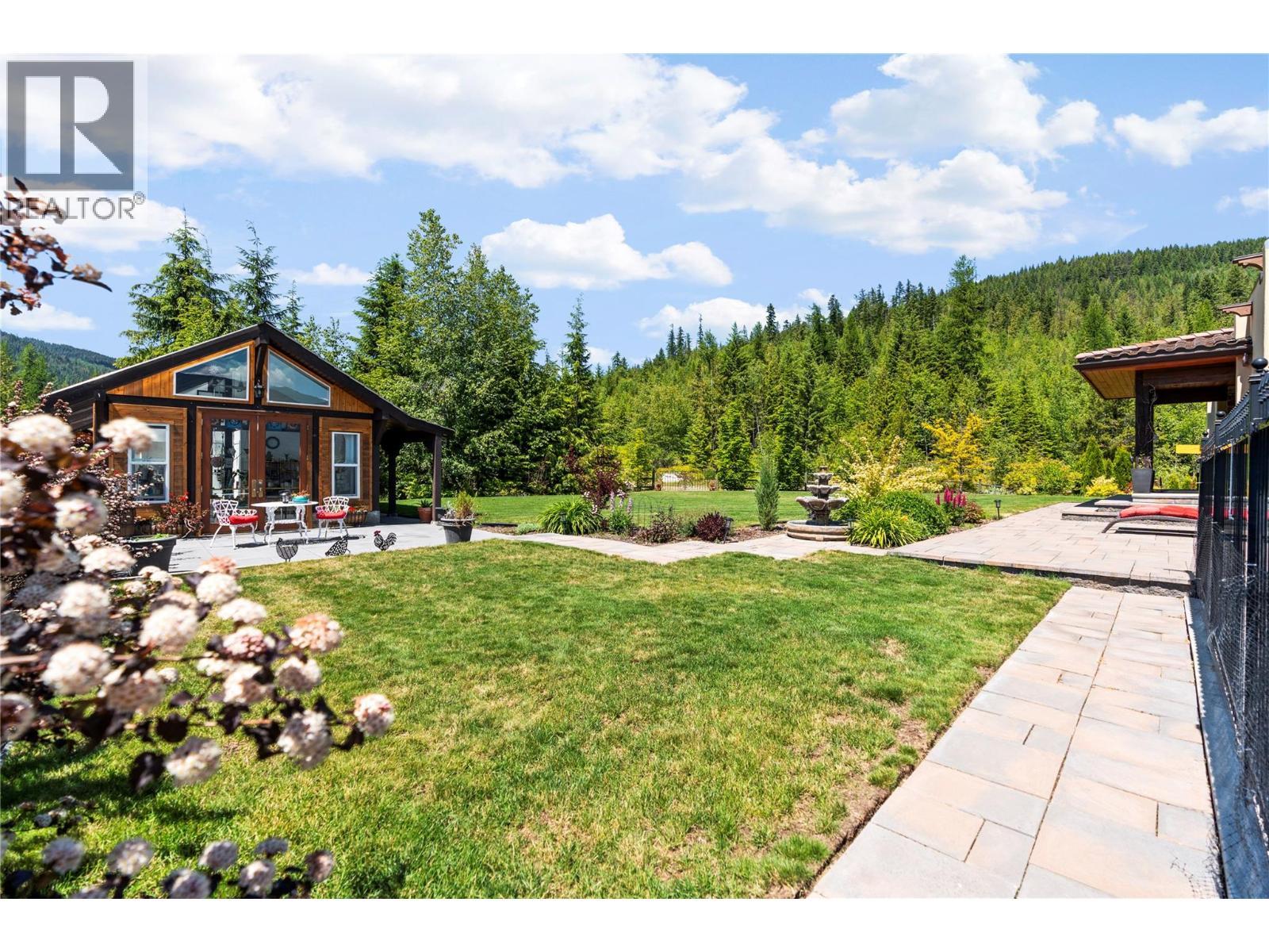 Walkway to the greenhouse studio - 1309 Eagle Ridge Road, Lumby, BC - Outdoor With Deck Patio Veranda