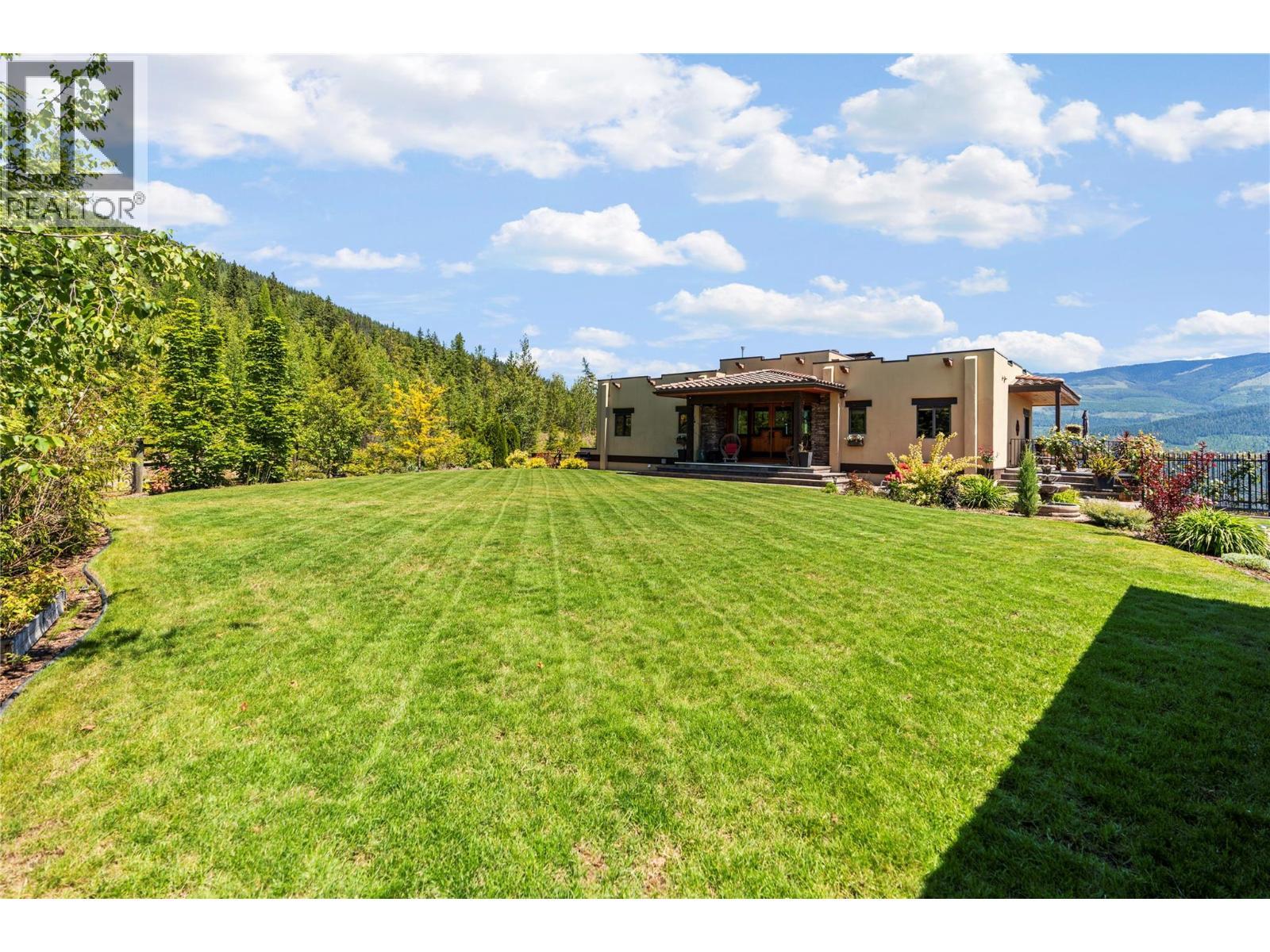Yard is fully irrigated on timers - 1309 Eagle Ridge Road, Lumby, BC - Outdoor