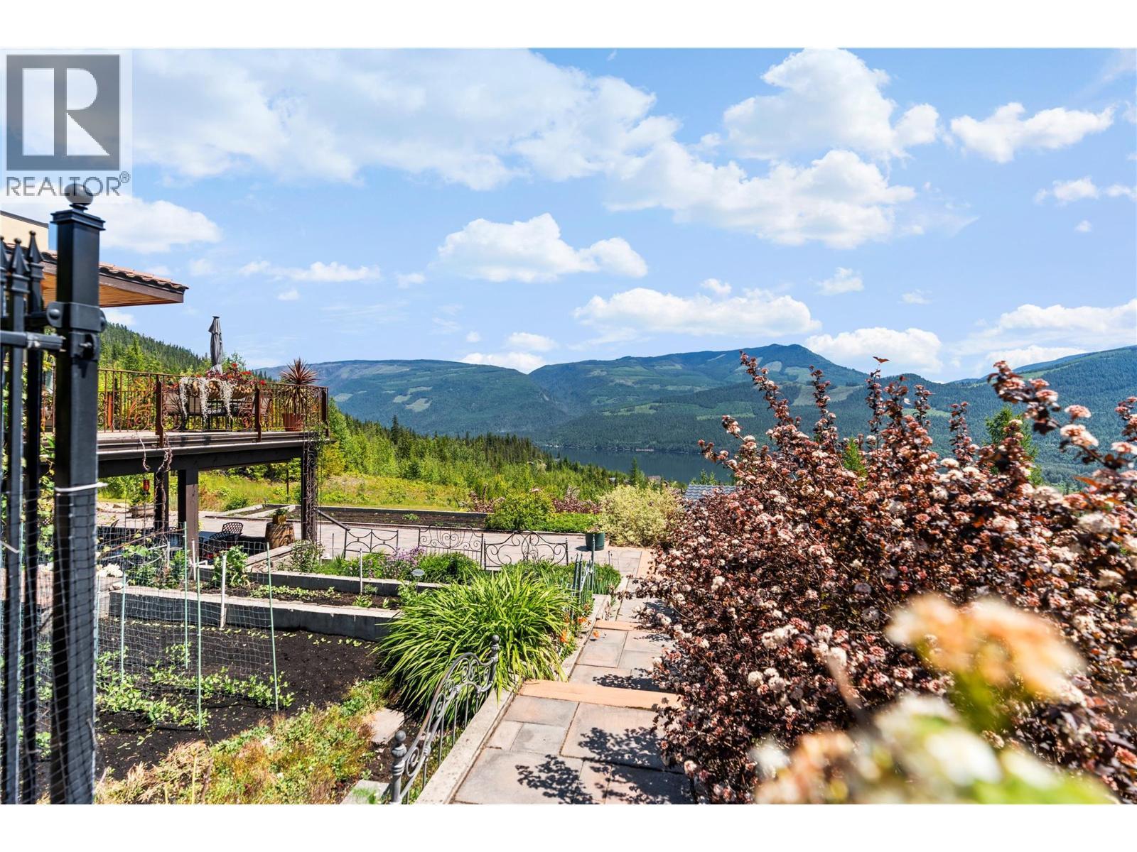 Pathway along the side of the tiered garden - 1309 Eagle Ridge Road, Lumby, BC - Outdoor With View