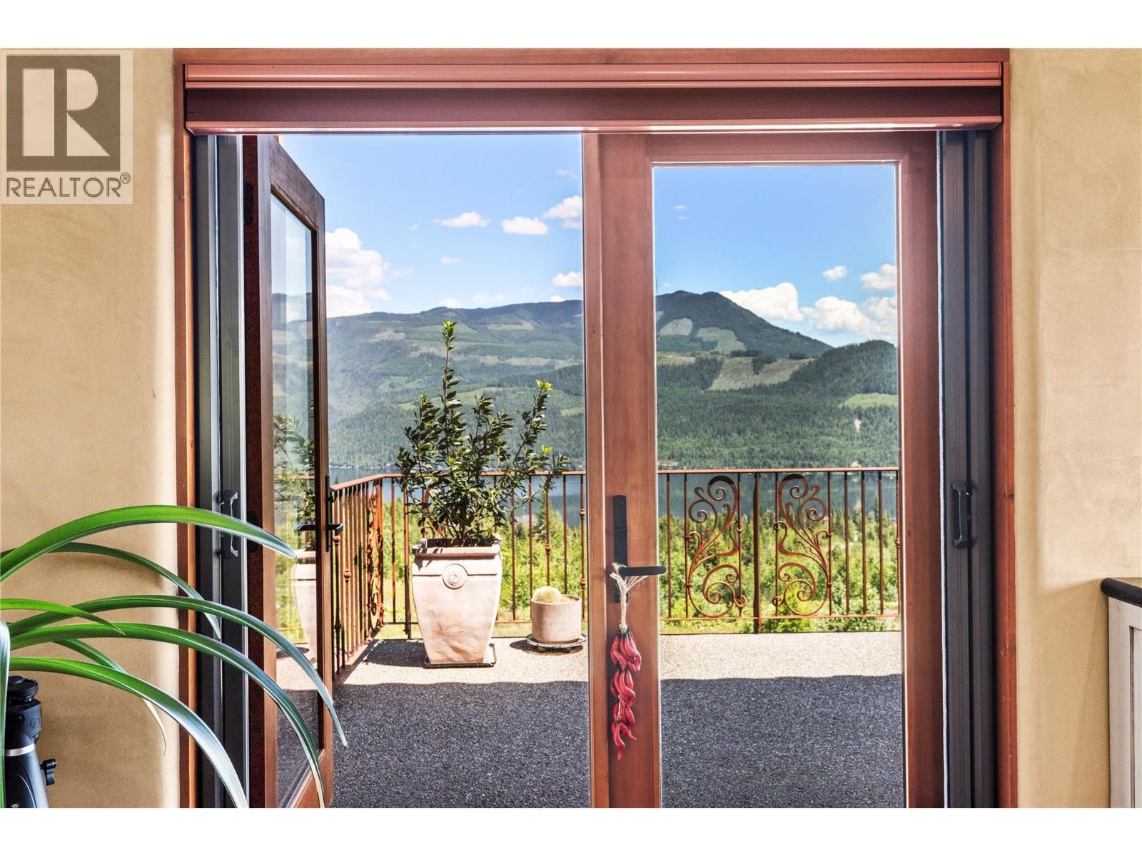 Main Floor Patio door to wrap around deck - 1309 Eagle Ridge Road, Lumby, BC - Indoor