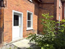 Side Entrance in Fenced Yard -