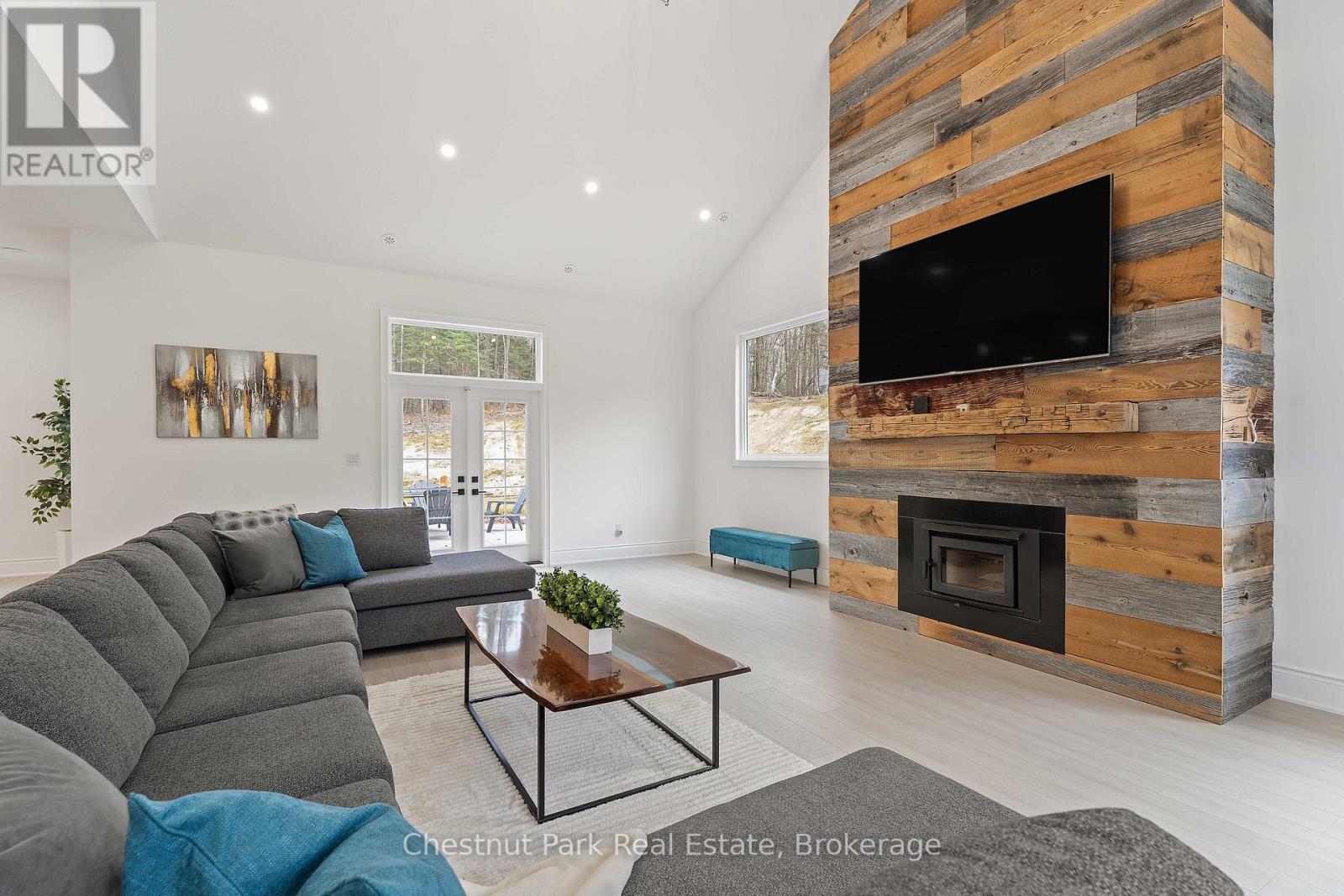 1153 Deer Lake Road, Perry (Emsdale), ON - Indoor Photo Showing Living Room With Fireplace