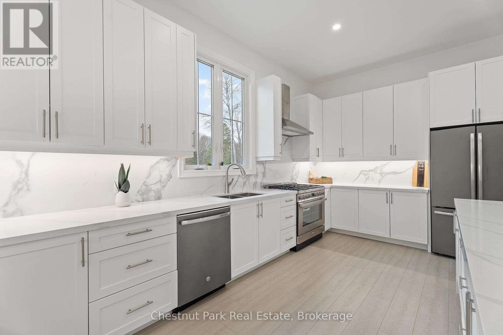 1153 Deer Lake Road, Perry (Emsdale), ON - Indoor Photo Showing Kitchen With Stainless Steel Kitchen With Double Sink With Upgraded Kitchen
