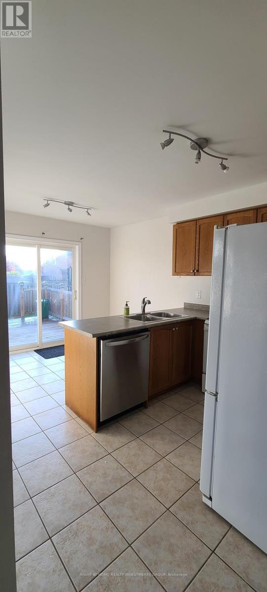 Kitchen w/o to backyard - 38 Lang Drive, Barrie, ON - Indoor Photo Showing Kitchen