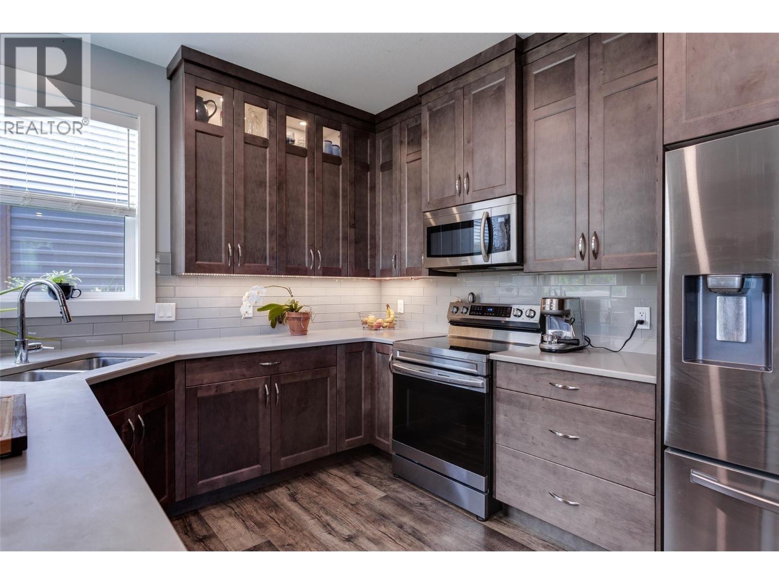 1257 And 1259 Rio Drive, Kelowna, BC - Indoor Photo Showing Kitchen With Double Sink