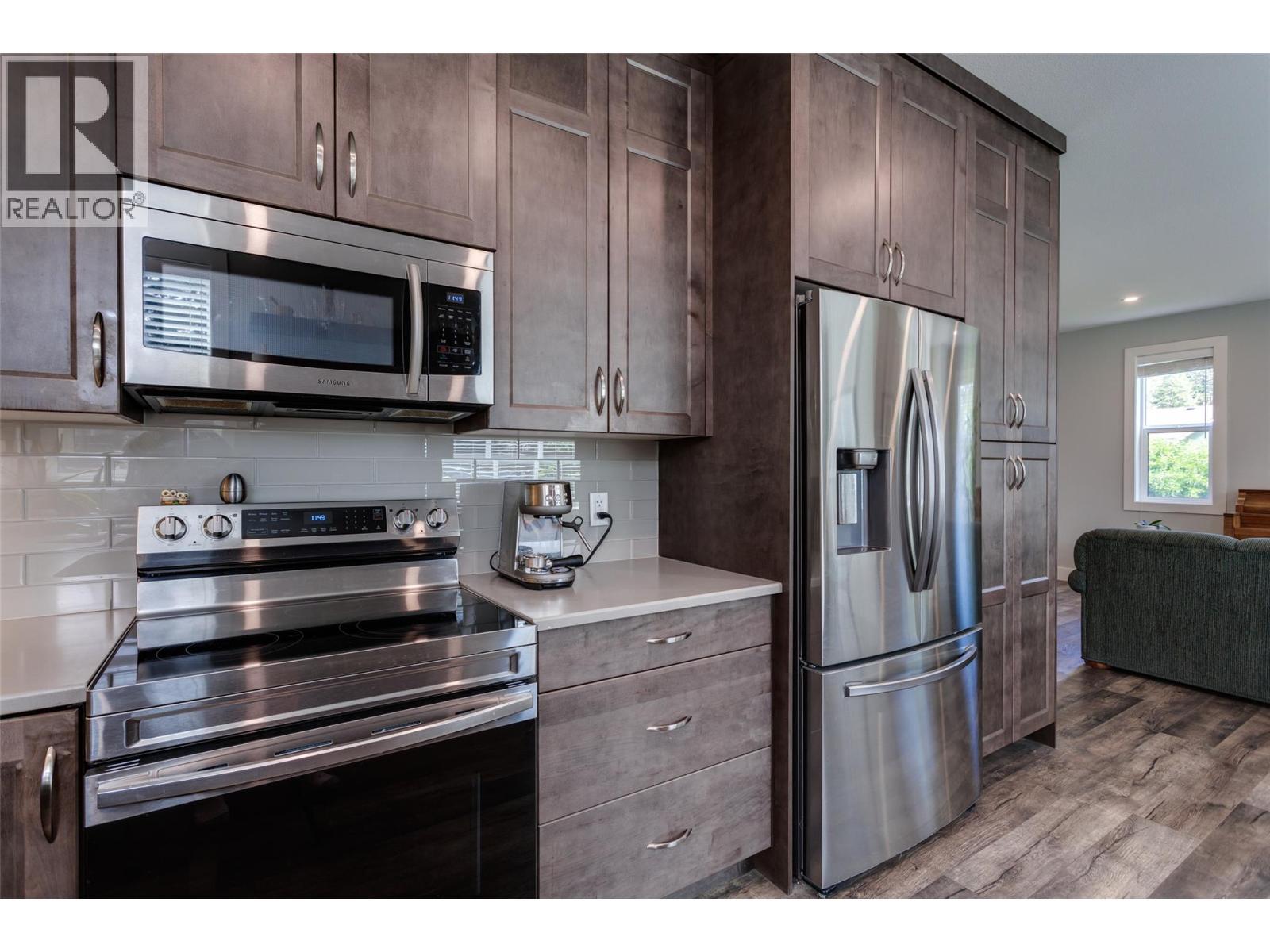 1257 And 1259 Rio Drive, Kelowna, BC - Indoor Photo Showing Kitchen