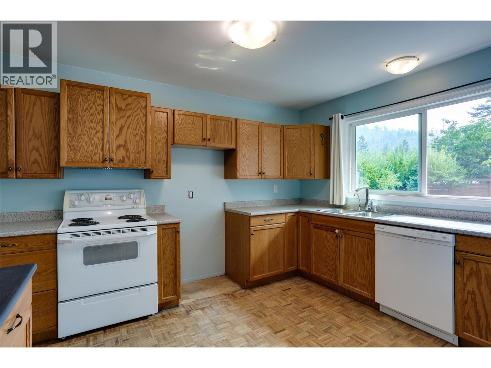 1257 And 1259 Rio Drive, Kelowna, BC - Indoor Photo Showing Kitchen