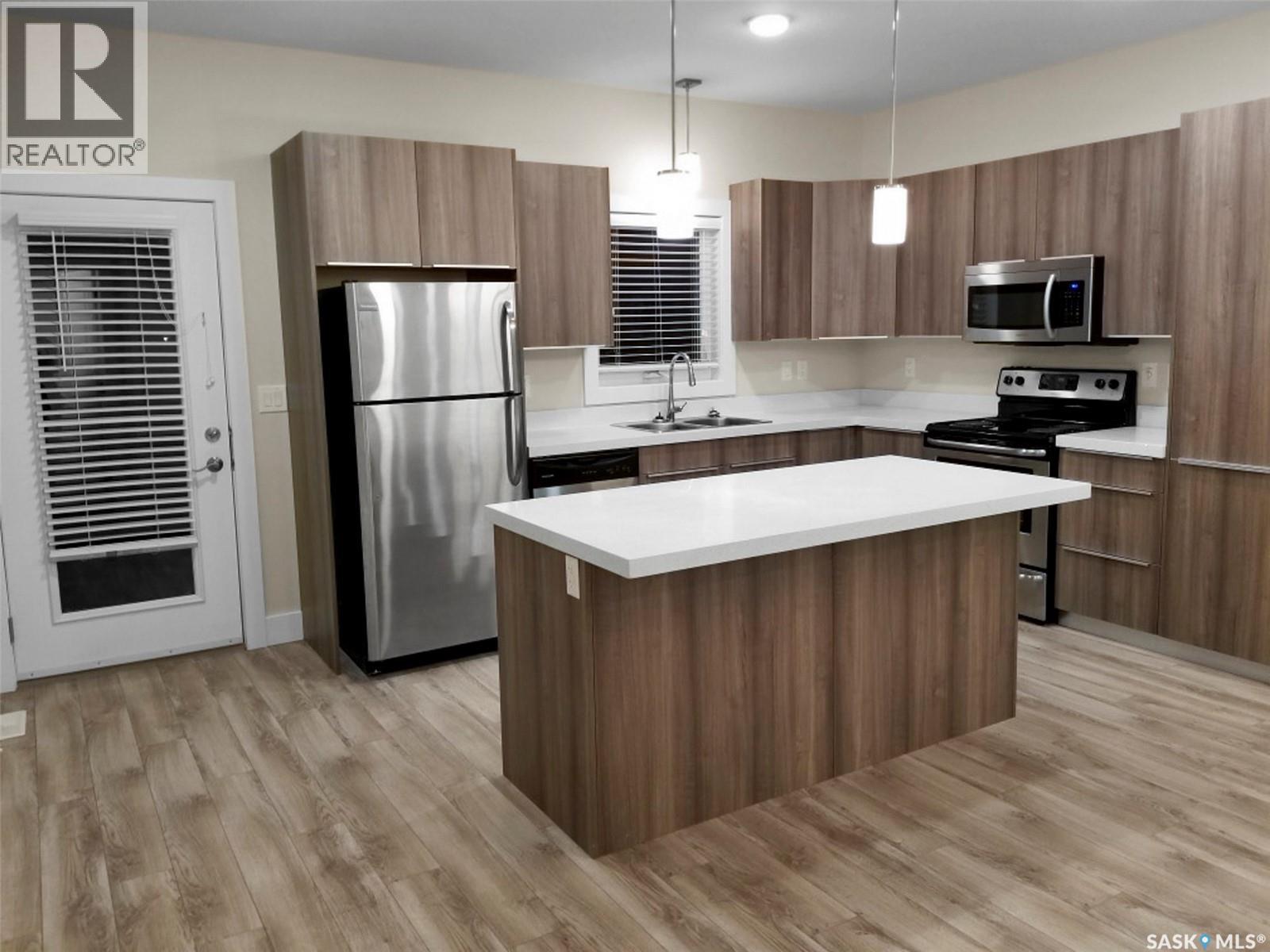 1-4 316 3Rd Street W, Delisle, SK - Indoor Photo Showing Kitchen With Double Sink With Upgraded Kitchen
