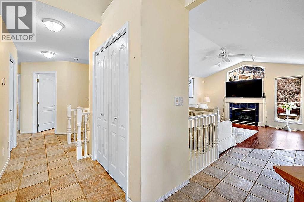 5205 Macneill Court, Peachland, BC - Indoor Photo Showing Other Room With Fireplace