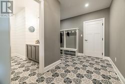 Custom tile work in mudroom and powder room -