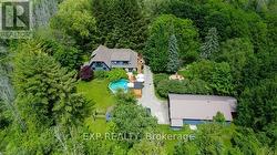 Aerial view of house, fire pit and detached garage -
