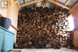 Walkout from basement wood storage -