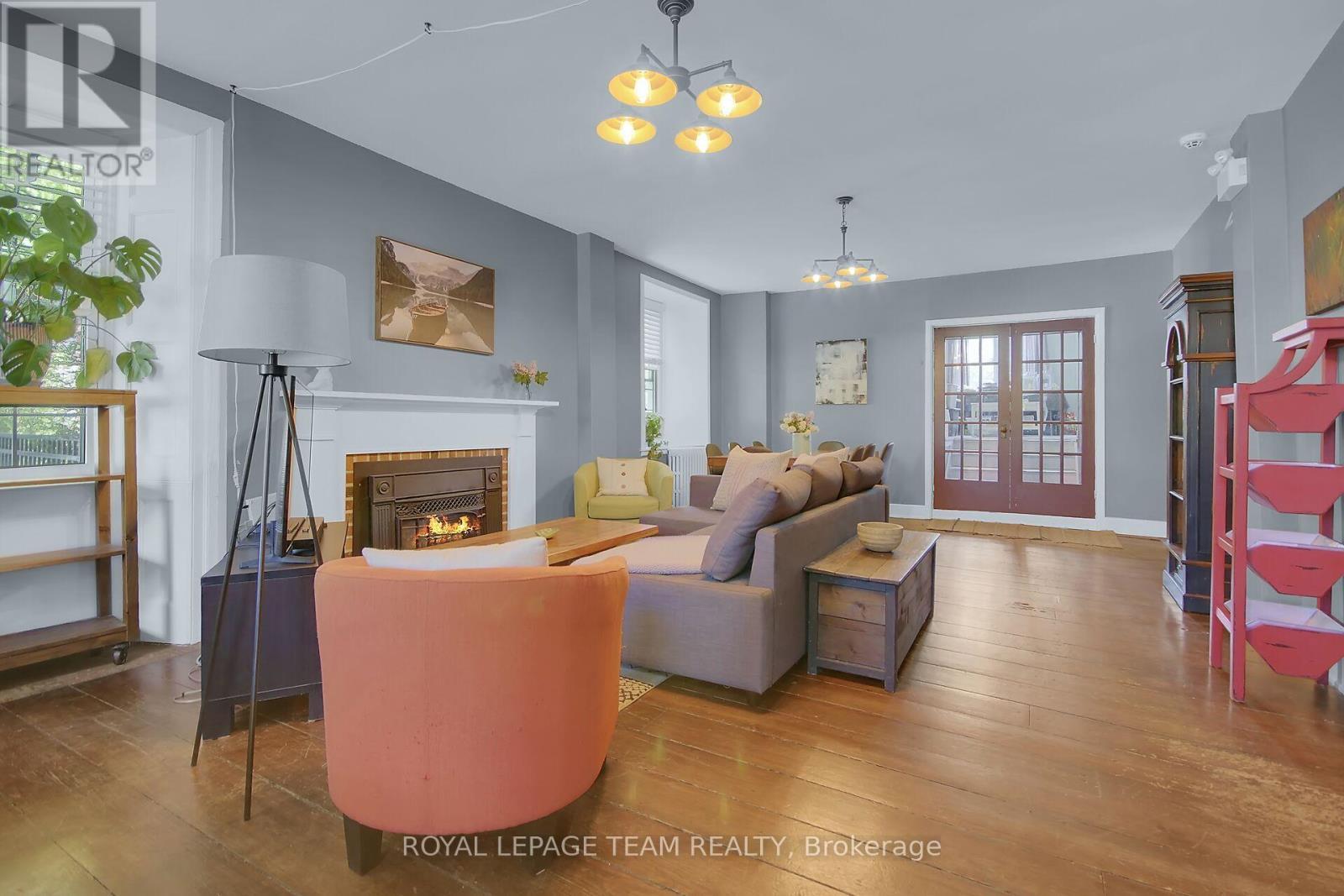 Current photo of home/building - 6 Spencer Street S, Edwardsburgh/Cardinal, ON - Indoor Photo Showing Living Room With Fireplace