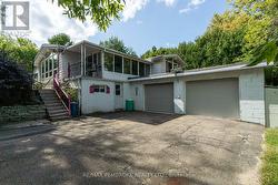 exterior view of sun porch & 2 bay garage -
