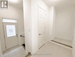 Mudroom with Side Entrance & Basement Access -