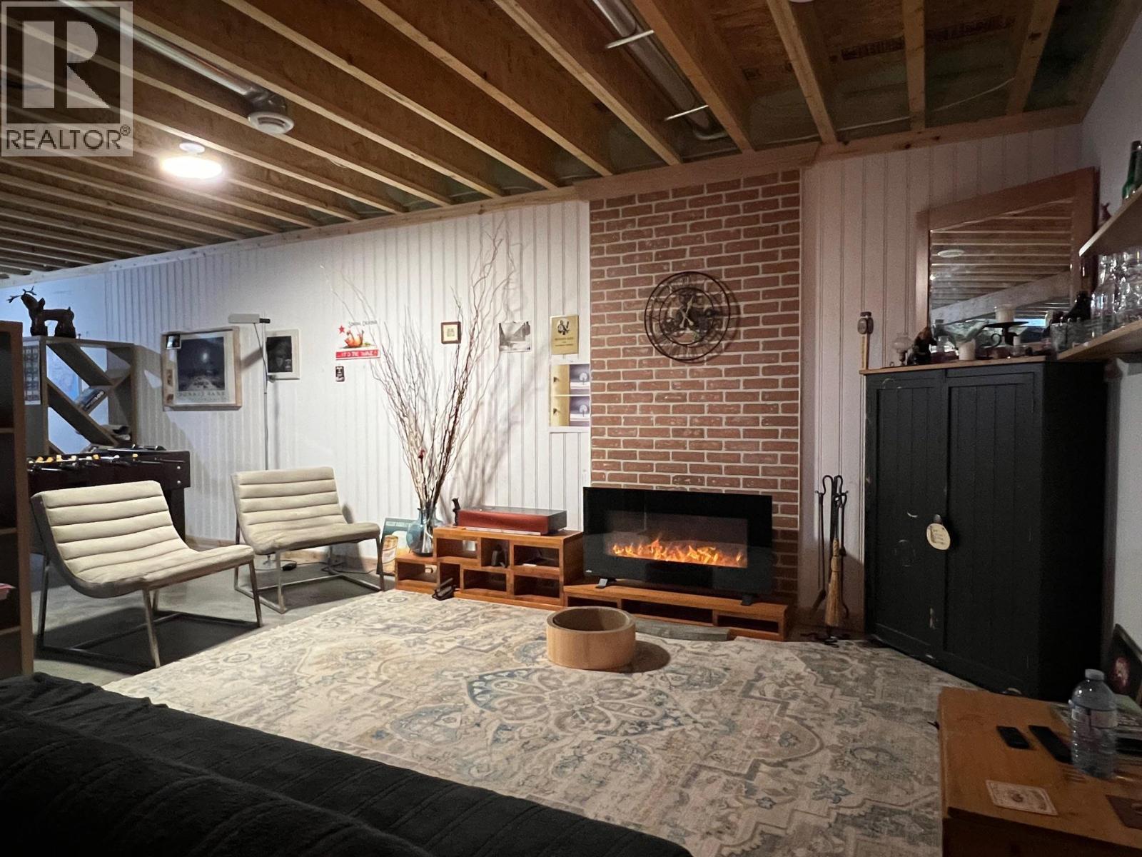 1029 10Th Avenue, Vernon, BC - Indoor Photo Showing Basement With Fireplace