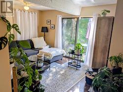 Lower level Living room view 2 with patio doors -