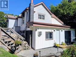 Back view of home and lower level entrance -
