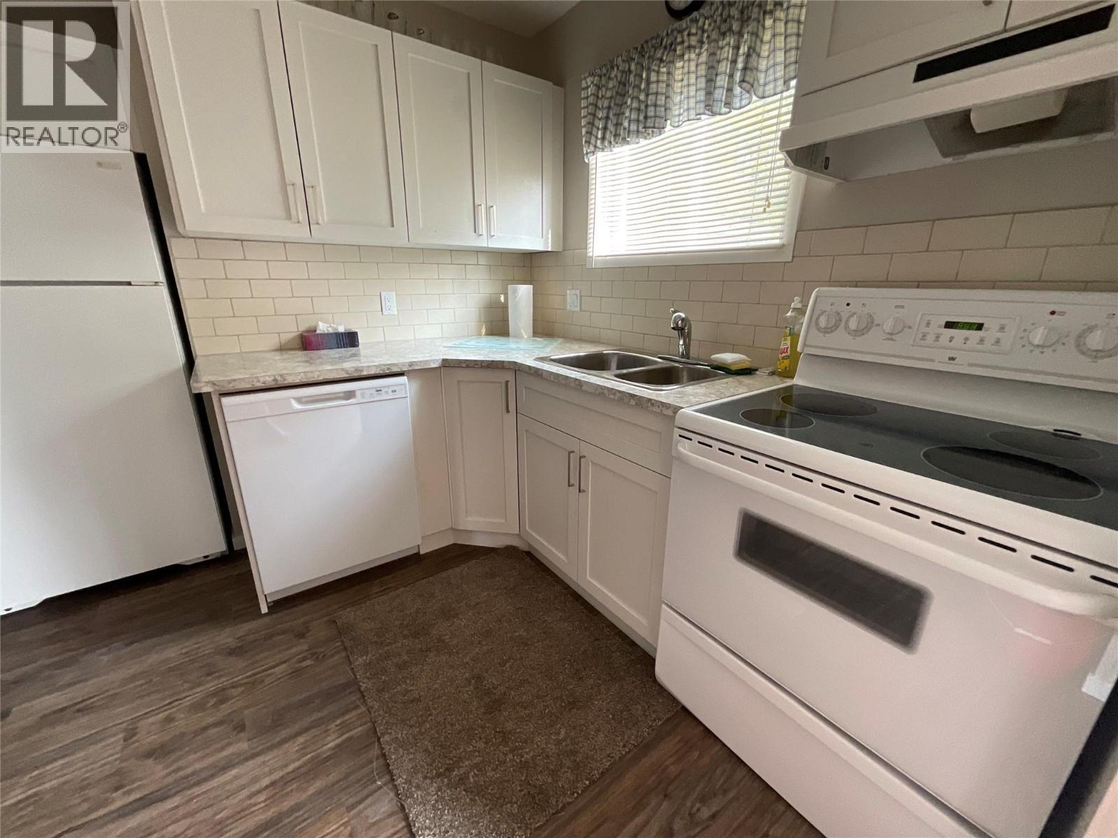 64 Merrick Place, Tumbler Ridge, BC - Indoor Photo Showing Kitchen With Double Sink