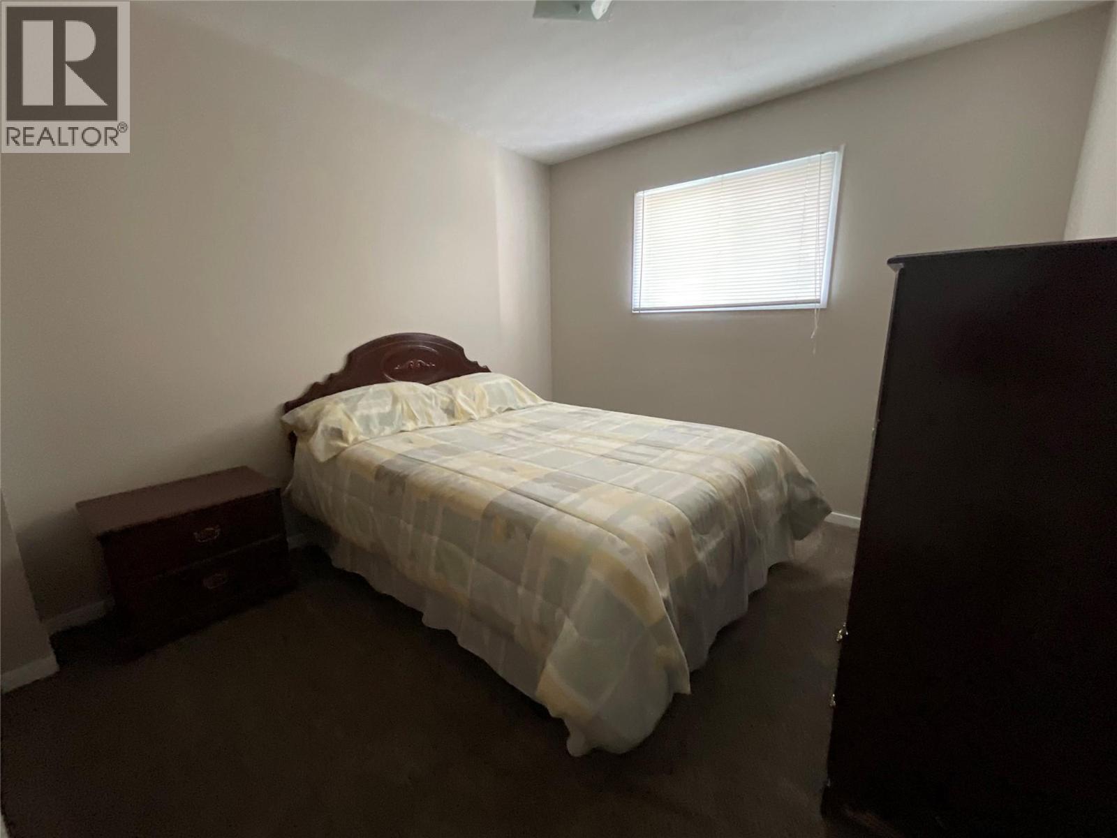 64 Merrick Place, Tumbler Ridge, BC - Indoor Photo Showing Bedroom