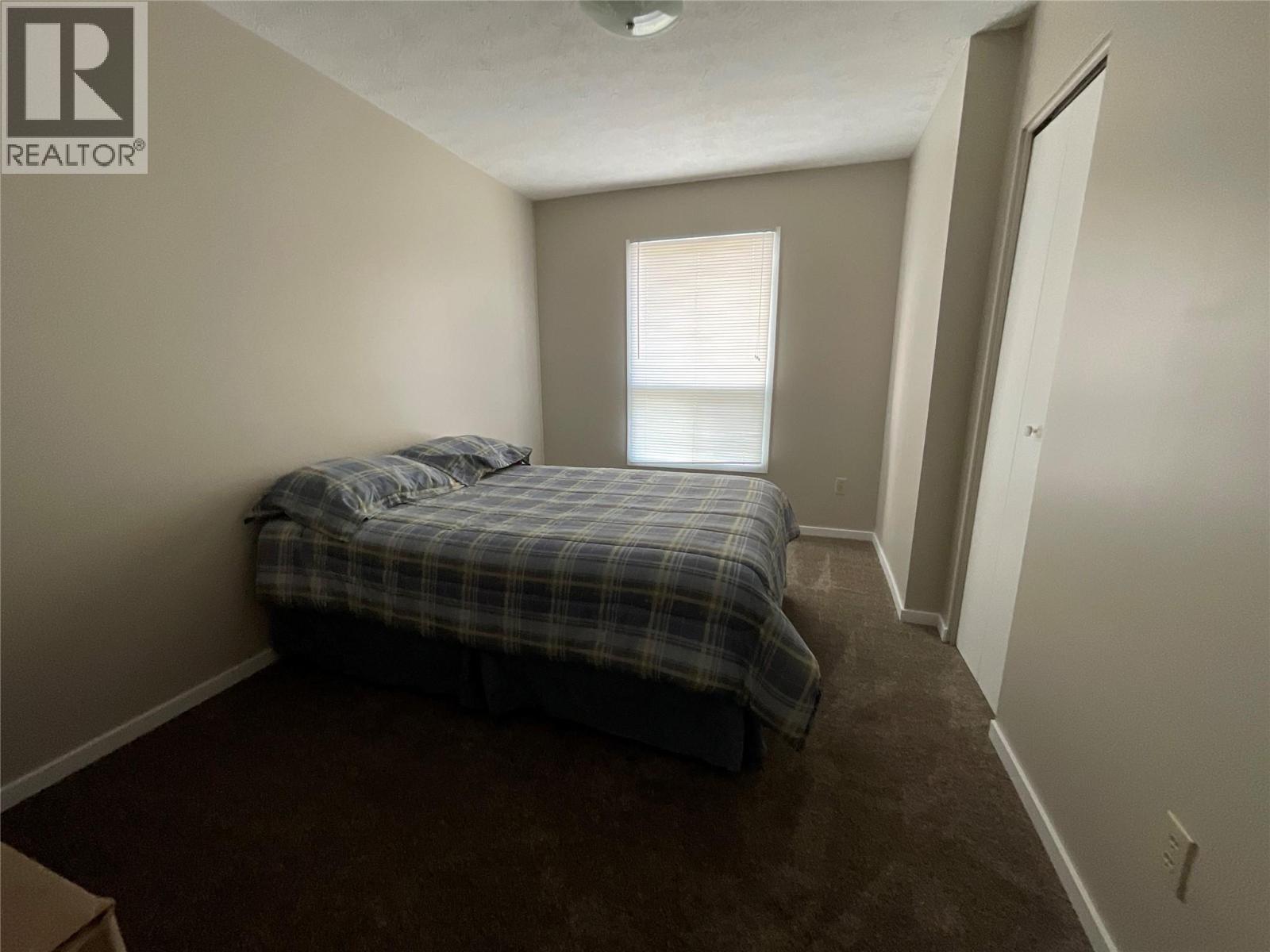 64 Merrick Place, Tumbler Ridge, BC - Indoor Photo Showing Bedroom