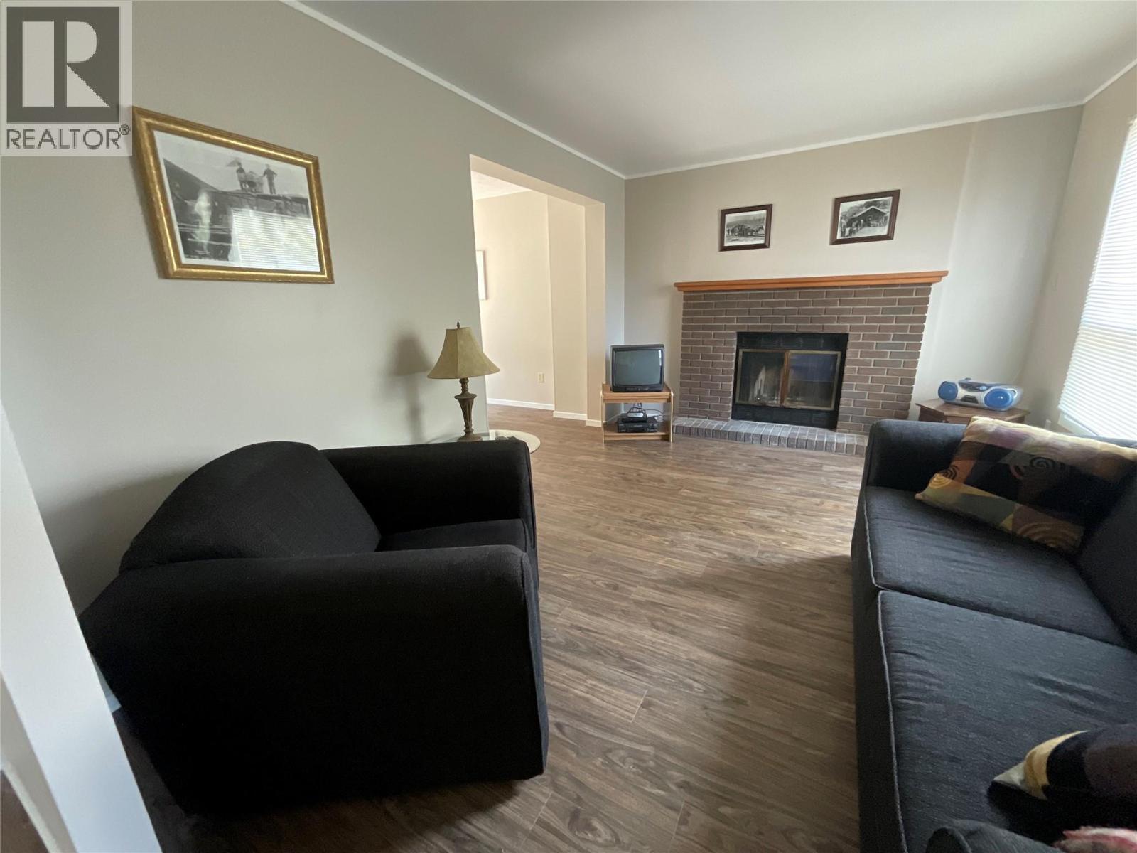 64 Merrick Place, Tumbler Ridge, BC - Indoor Photo Showing Living Room With Fireplace